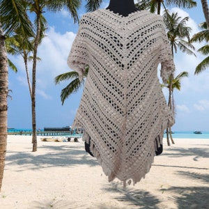 “Oversized hand-crocheted cotton poncho dress for women, perfect for boho festivals, casual summer days, or beachwear.”