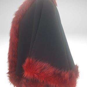 Alpaca Wool Short Cape, Jacket with Red Fur Trim , The garment is displayed on a mannequin against a neutral background, highlighting chic and soft garment