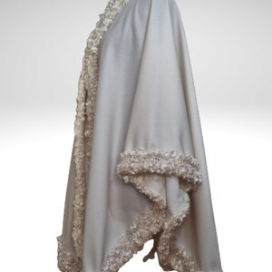 Cashmere Coat, Jacket with Lavish Trim is displayed on a mannequin against a neutral background, highlighting the texture and sparkle of the lavish trim.