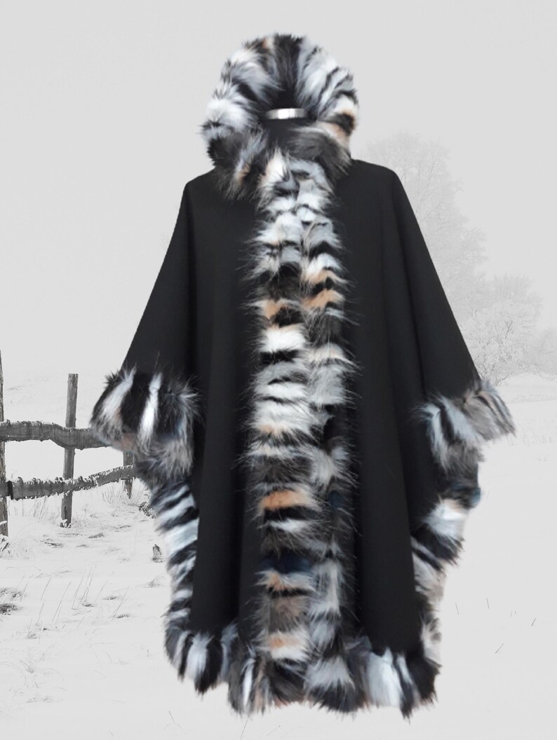 “Front angled view of a hooded black cashmere wool cape with dramatic multicolor  fur trim, blending modern luxury with classic winter charm.”