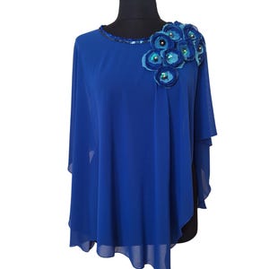 Perfect to wear for a wedding or a special occasion such as a party or a dinner out/dating.
This embellished cape wrap the brings a sparkling touch to a simple outfit and can easily be combined with a classic dress or a plain / basic top.
Handmade and high quality, the fabric is light and soft on the skin.