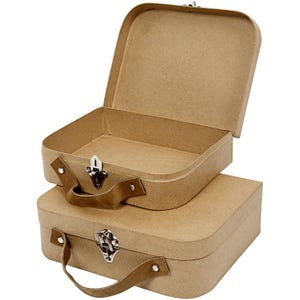 May include: Two brown cardboard suitcases, one stacked on top of the other. The top suitcase is open, revealing the interior. Both have brown leather handles and silver clasps. The suitcases are a light brown colour.