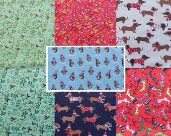 May include: A collage of six different fabric patterns featuring holiday themes. The patterns include penguins wearing hats, dachshunds wearing scarves and hats, holly leaves and berries, and candy canes.
