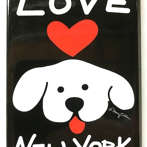 May include: Black and white magnet with a white dog face, a red heart, and the words "LOVE NEW YORK" in white. The artist's signature is in the bottom right corner.