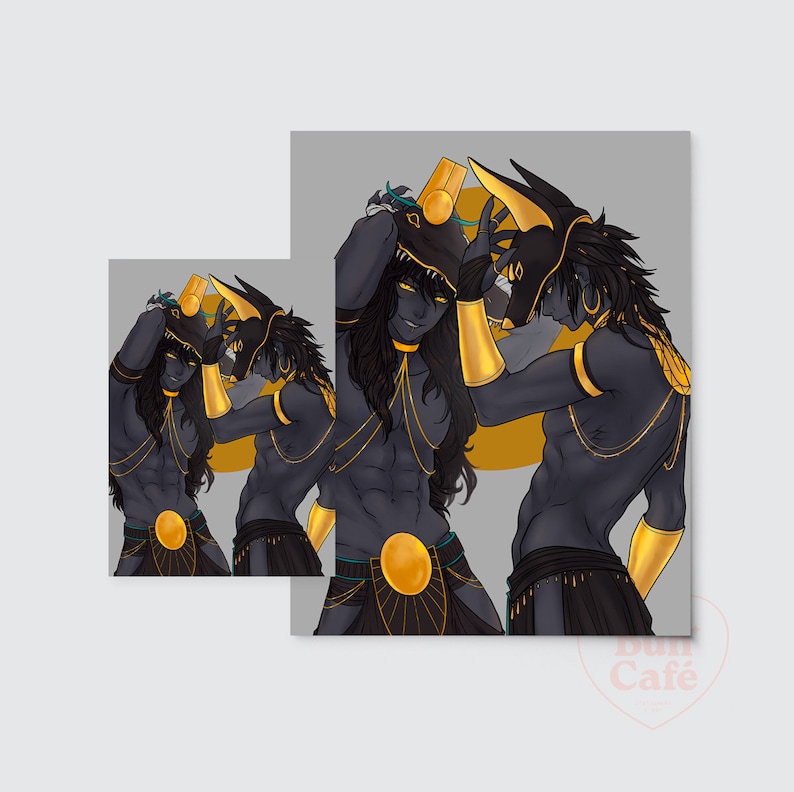May include: Two figures with black skin and gold accents are wearing elaborate headdresses and jewelry. They are posed in a dynamic fashion, with one figure holding the other's headdress. The background is a simple gray.