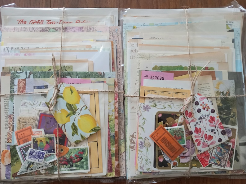 May include: Two bundles of assorted vintage paper ephemera, including maps, book pages, and tickets, wrapped in twine. Each bundle features a decorative tag, one with a lemon print and one with a floral print, plus various postage stamps.
