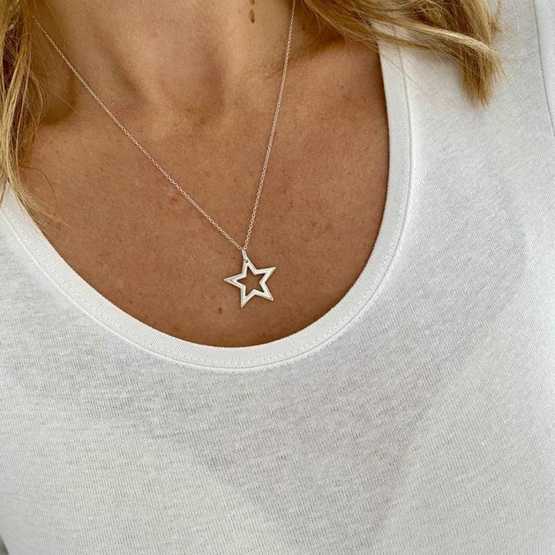 Celestial star necklace in sterling silver with large star pendant.