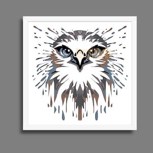 May include: A framed art print featuring a stylized illustration of an eagle's face. The artwork uses a palette of white, brown, blue, and gray. The eagle's eyes are detailed with blue and brown hues, and the design has a splatter effect.