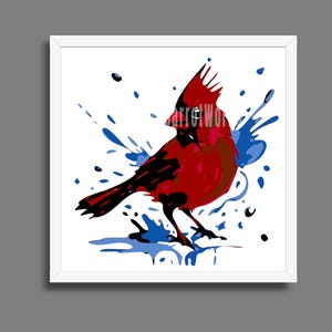 May include: A framed art print featuring a stylized cardinal bird in shades of red and black, set against a white background with blue paint splatters. The artwork has the text "arretWor" in the upper right corner.