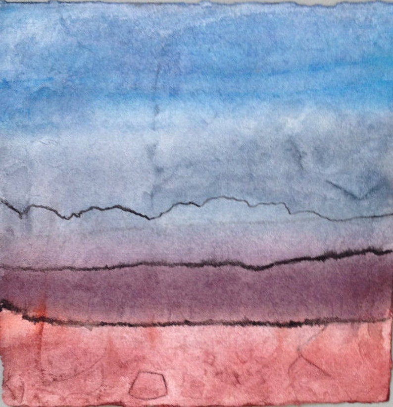 May include: Abstract watercolour painting with a gradient of colours. The top portion is blue, transitioning to grey, then purple, and finally a reddish-orange at the bottom. Black lines suggest a landscape.