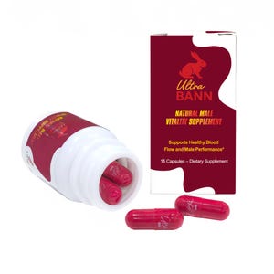 May include: A white bottle with a red label and red capsules. The label reads "Ultra Bann Natural Male Vitality Supplement". A box with the same design and text is also present. The capsules are red.