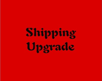 May include: A red background with the words "Shipping Upgrade" in black, stylized font. The text is centered and takes up a significant portion of the image.