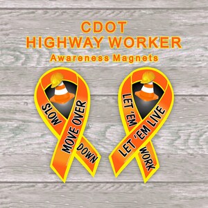May include: Two orange and yellow ribbon magnets with the text "SLOW MOVE OVER DOWN" and "LET 'EM LET 'EM LIVE WORK" on them. Each ribbon has a construction cone and hard hat graphic in the center.