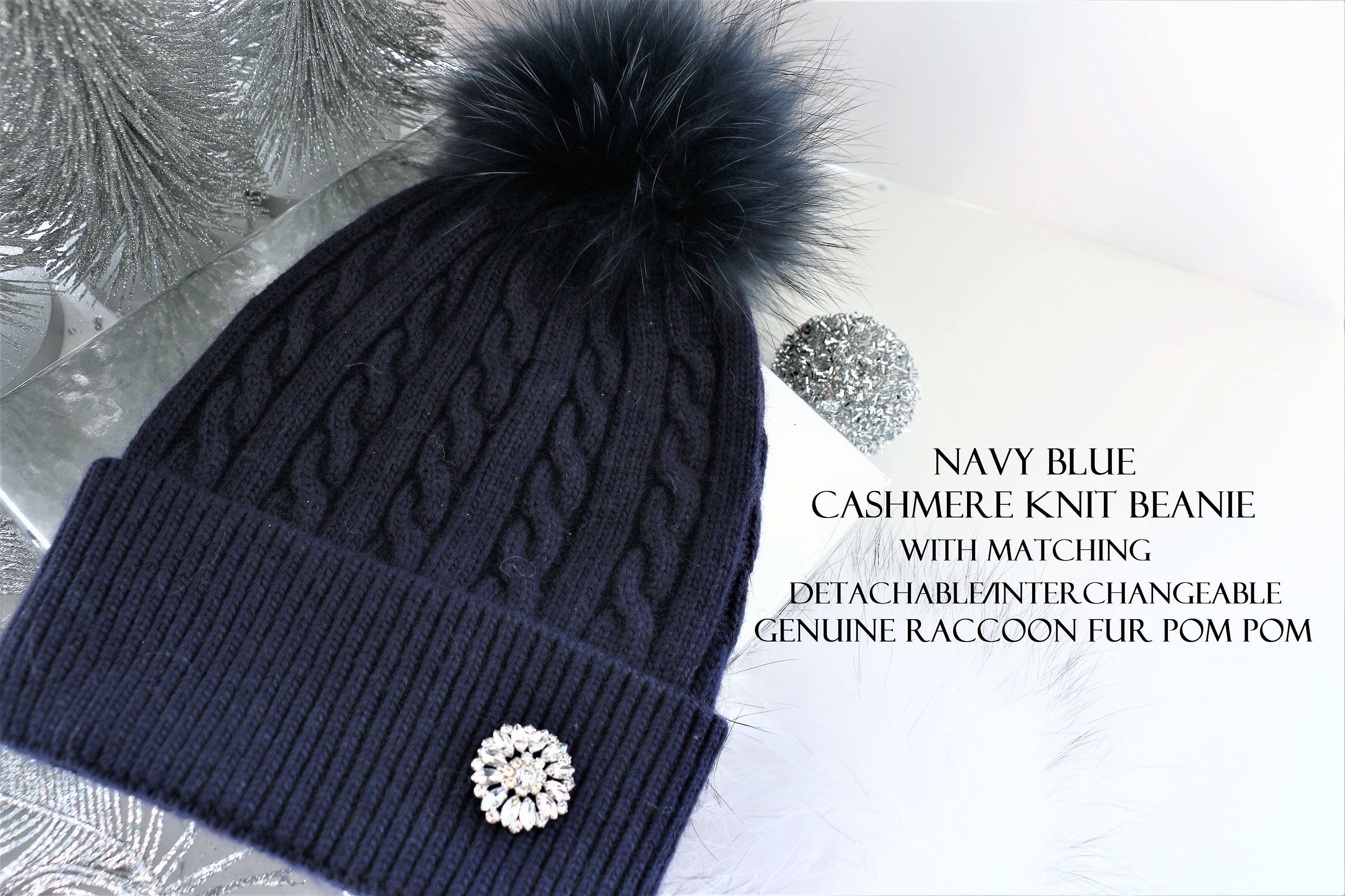 navy bobble hat with fur pom pom