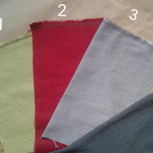 May include: Four fabric swatches in different colors: light green, red, gray, and dark gray. The swatches are labeled with numbers 1 through 4.