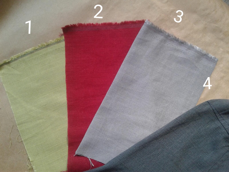 May include: Four fabric swatches in different colors: light green, red, gray, and dark gray. The swatches are labeled with numbers 1 through 4.