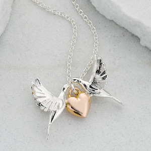Beautiful silver kissing doves necklace with golden heart
