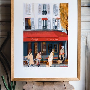 May include: A painting of a Parisian cafe with a red awning that says "Parisii pour boire et manger". There are people sitting outside the cafe and a person riding a bicycle.