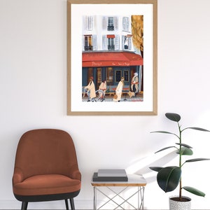 May include: A framed illustration of a Parisian cafe with a red awning that says "Paris" and "Le Bar et Mange". The cafe is on a street corner with people walking by and a bicycle parked in front.