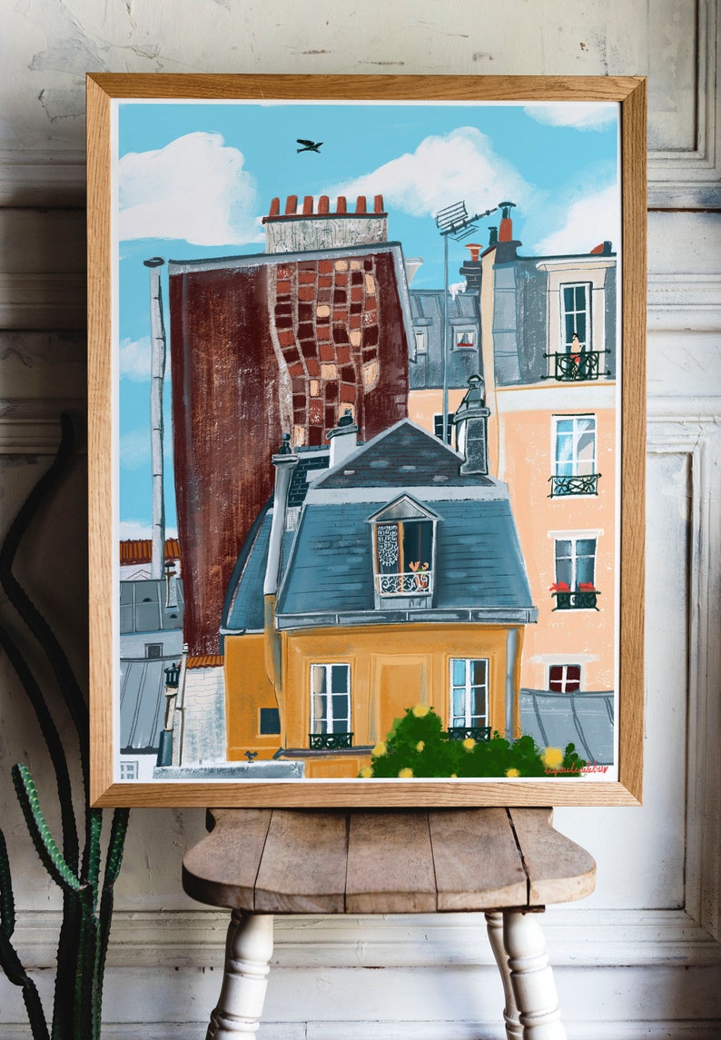 May include: A painting depicting a Parisian cityscape, featuring a yellow building in the foreground with a blue roof and a small balcony with a window. The building is surrounded by other buildings with red brick and brown facades. The sky is blue with white clouds and a bird flying overhead.