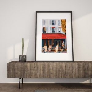 May include: A framed painting of a Parisian street scene with a cafe called "Parisya" with a red awning. People are walking by the cafe, and there is a bicycle parked in front of it.