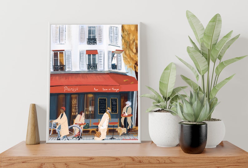 May include: A painting of a Parisian cafe with a red awning that says "Paris" and "Pour boire et manger". There are people sitting outside the cafe and a person riding a bicycle.