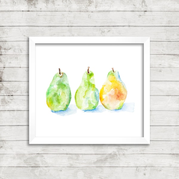 Pode incluir: Pintura em aquarela emoldurada com três peras. As peras são em tons de verde e amarelo, com um toque de azul na base. A obra de arte é exibida em um fundo de madeira branca.