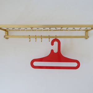 beautiful old wall coat rack, vintage coat rack, mid century hallway coat rack, 50s 60s, gold-colored, coat hooks, living