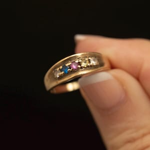 Vintage Familienring aus 10-karätigem Gold · Ring mit Rubin, Topas und Spinell sowie mehreren Edelsteinen