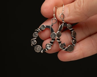 Handmade Silver Oval Cutout Dangle Earrings with Wirework and Textured Disks