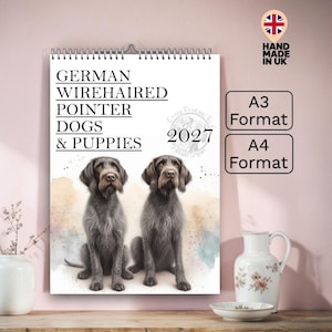 May include: A calendar featuring two German Wirehaired Pointers and the text "GERMAN WIREHAIRED POINTER DOGS & PUPPIES 2027". The calendar is available in A3 and A4 formats, with a "Hand Made in UK" label.