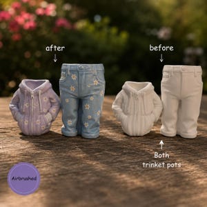 May include: Two sets of trinket pots shaped like hoodies and jeans. The left set is airbrushed in light purple and blue with white daisy patterns. The right set is plain white. Text labels indicate after and before states for the pots.