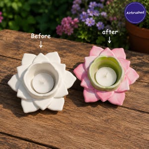 May include: Two lotus flower candle holders with tea lights. The left holder is plain white. The right holder is airbrushed with pink petals and a light green centre. Text labels read Before, after, and Airbrushed with arrows pointing to each item.