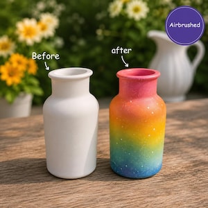 May include: Two small vases, one plain white and one airbrushed with a rainbow gradient of pink, orange, yellow, green, and blue with white speckles. The white vase is labelled Before and the rainbow vase is labelled after with Airbrushed text.