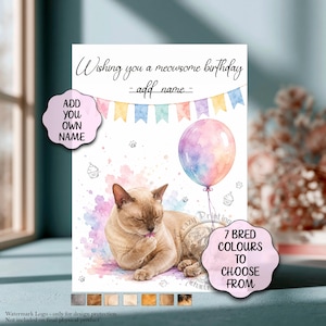 May include: A birthday greeting card featuring a watercolour illustration of a light brown cat grooming its paw. The card includes a pastel bunting banner, a colourful balloon, small cupcake drawings, and the text Wishing you a meowsome birthday.