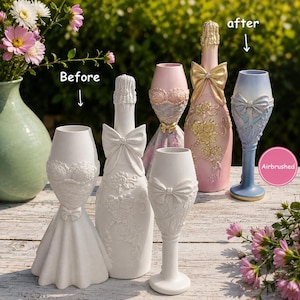 May include: A collection of decorative champagne bottle and flute sculptures. The set includes plain white unpainted pieces labelled Before and finished pieces in pink, gold, and blue with floral and bow details labelled after and Airbrushed.