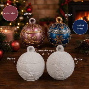 May include: Four spherical trinket boxes with removable tops. Two are white, unpainted ornaments. Two are airbrushed: one metallic pink with gold holly leaves, and one metallic blue with gold snowflakes. Text labels include Airbrushed, after, trinket boxes, removable top, and Before.