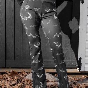 May include: A set of three ceramic mugs with a speckled, matte finish. The mugs are in shades of cream, light gray, and dark gray. Each mug has a simple, modern design and a rounded handle.