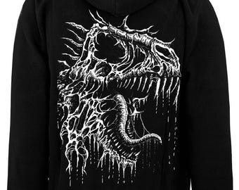 May include: A black hooded sweatshirt featuring a large white graphic print on the back. The design depicts a detailed, skeletal dinosaur head with sharp teeth, a long tongue, and dripping, viscous textures throughout the illustration.