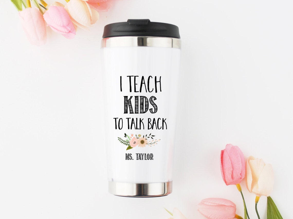 A white tumbler with words
