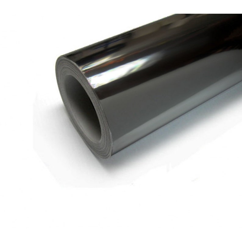 May include: A roll of black chrome vinyl wrap. The vinyl is shiny and reflective.