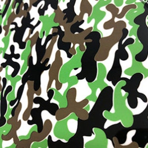 May include: Abstract camouflage pattern in shades of green, brown, black, and white.