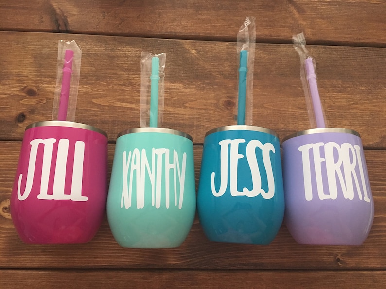 May include: Four stainless steel tumblers with lids and straws. The tumblers are in pink, teal, blue, and purple. Each tumbler has a name on it: Jill, Vanthy, Jess, and Terri.