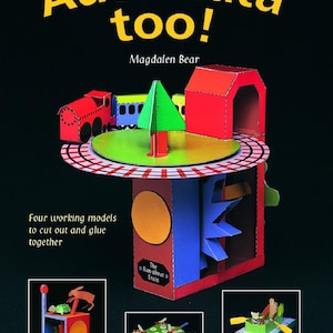 May include: A book cover with the title "Automata too!" by Magdalen Bear. The cover features a colorful paper model of a train set with a green tree and a red building. The book includes four working models to cut out and glue together. The models are: The Run-about Train, The Hare & The Tortoise, The Busy-buzzy Bees, and The Owl & The Pussycat.