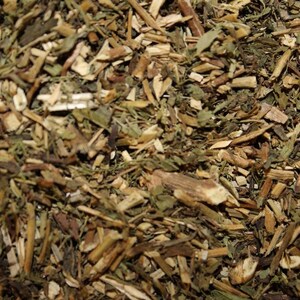 May include: A close-up of a mixture of dried herbs and roots, including green leaves, brown stems, and light brown pieces of bark.