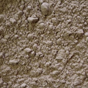 May include: A close-up view of a light brown powder. The powder is finely ground and has a uniform texture.