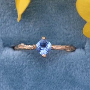 14 Karat Yellow Gold Woodland Solitaire with a 4mm Blue Cushion Montana Sapphire