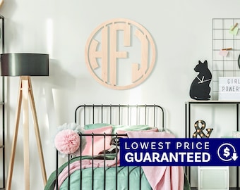 May include: A circular wooden monogram wall hanging featuring the letters H, F, and J in a cutout design. The light-colored wood piece is mounted on a wall above a bed, showcasing a clean, natural finish with bold, block-style lettering.