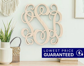 May include: A light-colored wooden wall hanging featuring an intricate, interconnected monogram of the letters S, S, and B in a cursive script font. The letters are joined together in a continuous, flowing design with decorative, swirling flourishes.