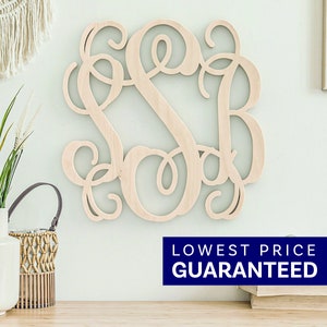May include: A light-colored wooden wall hanging featuring an intricate, interconnected monogram of the letters S, S, and B in a cursive script font. The letters are joined together in a continuous, flowing design with decorative, swirling flourishes.